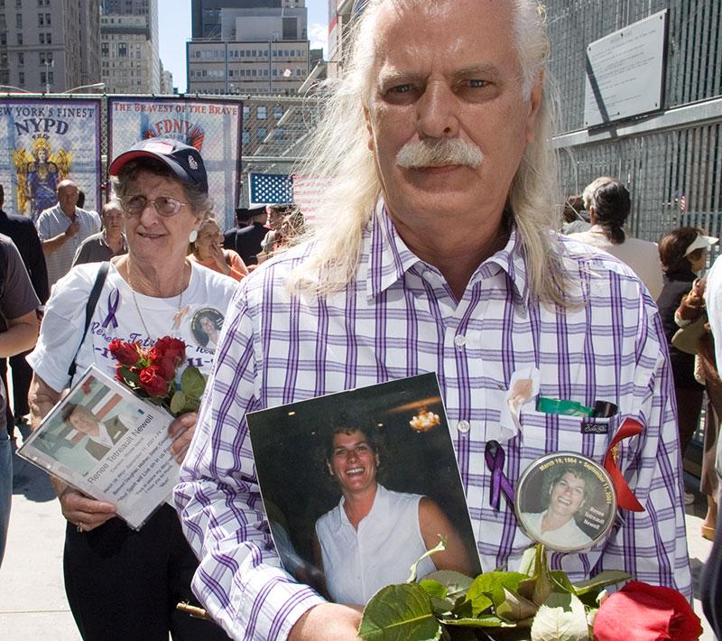 man-holding-photo-flowers 